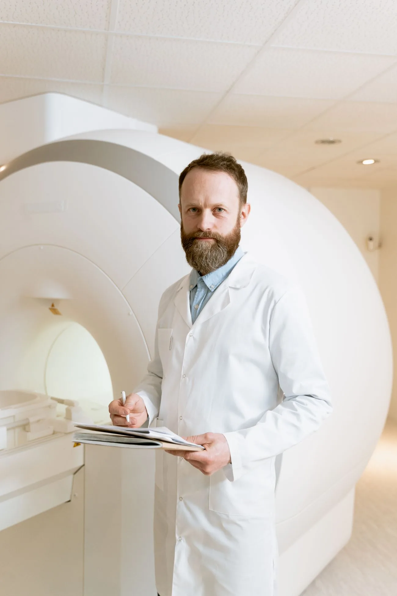 Radiologist reviewing medical imaging scans with AI assistance