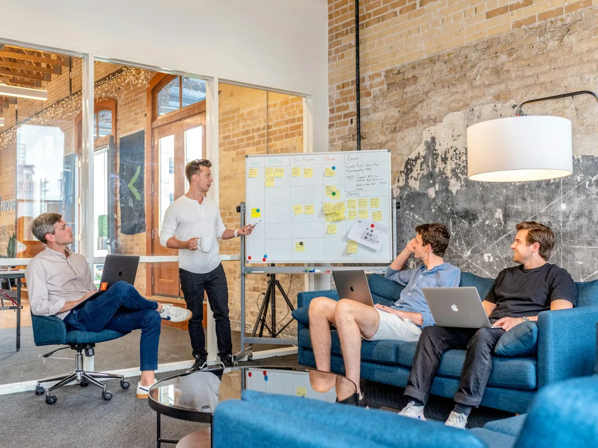 Marketing team planning a data-driven campaign strategy on a whiteboard